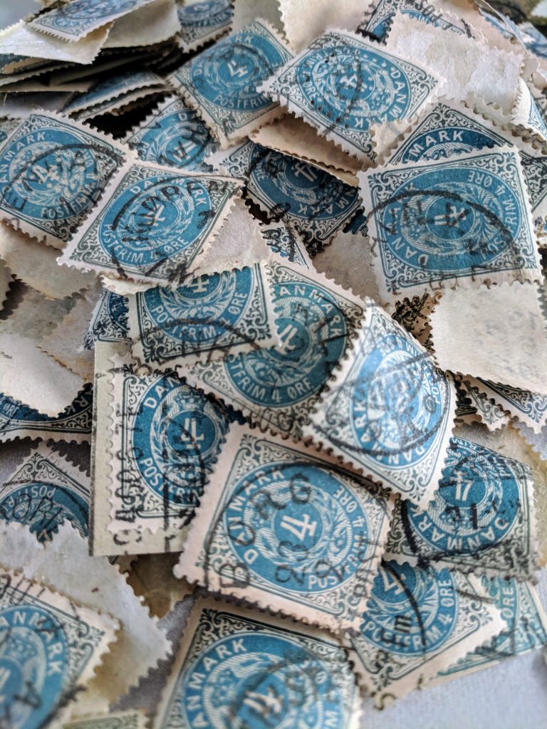 a pile of loose stamps