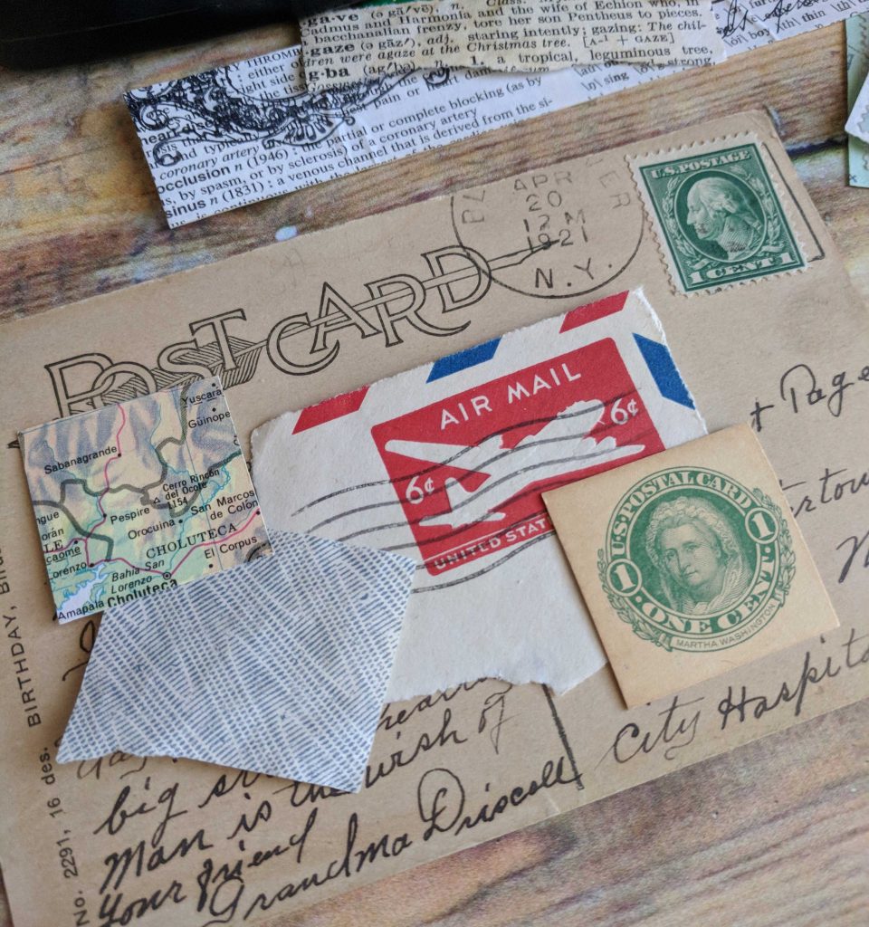 A postcard is collaged with postal mail ephemera