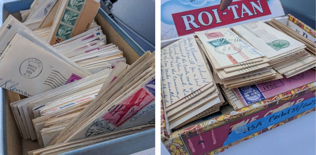 shoe boxes filled with cards of postage stamps with postmarks