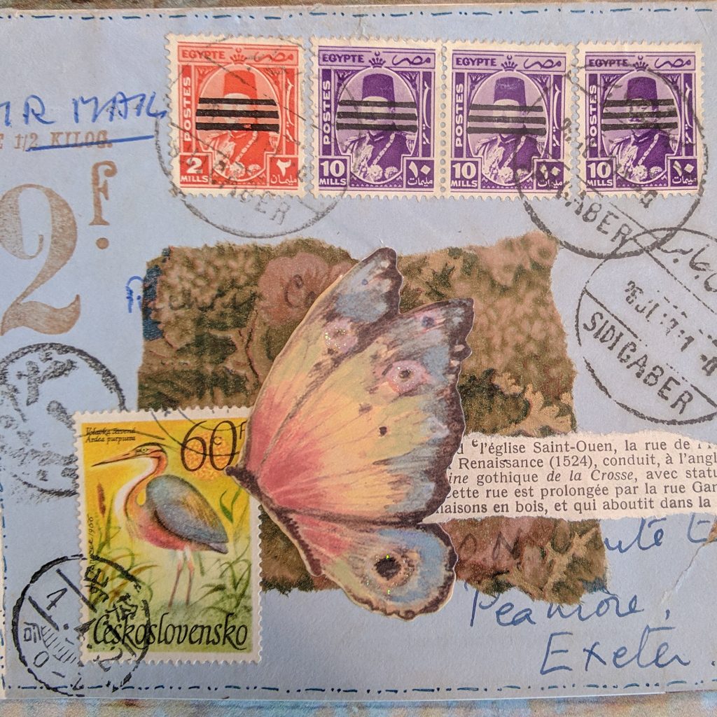 a vintage collage over a light blue envelope