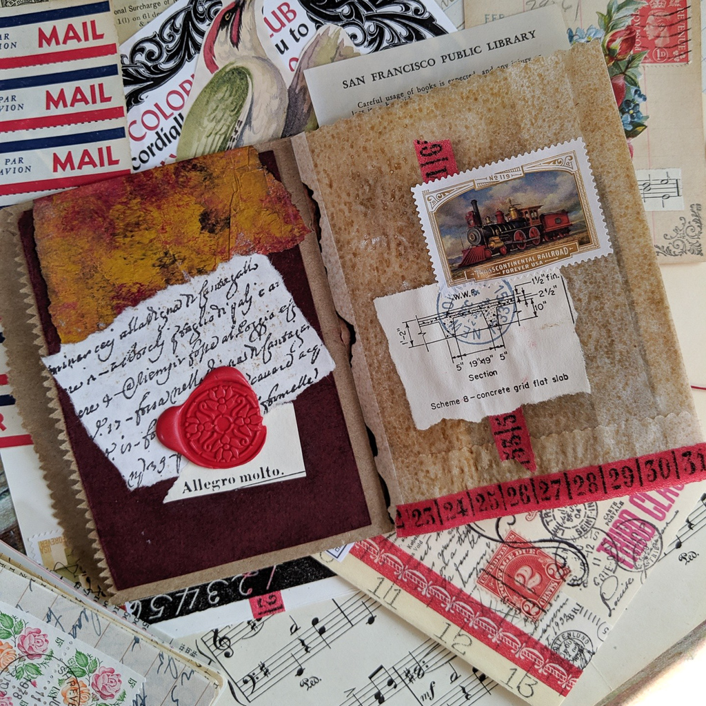 A spread of various pieces of paper decorated with a locomotive postage stamp.