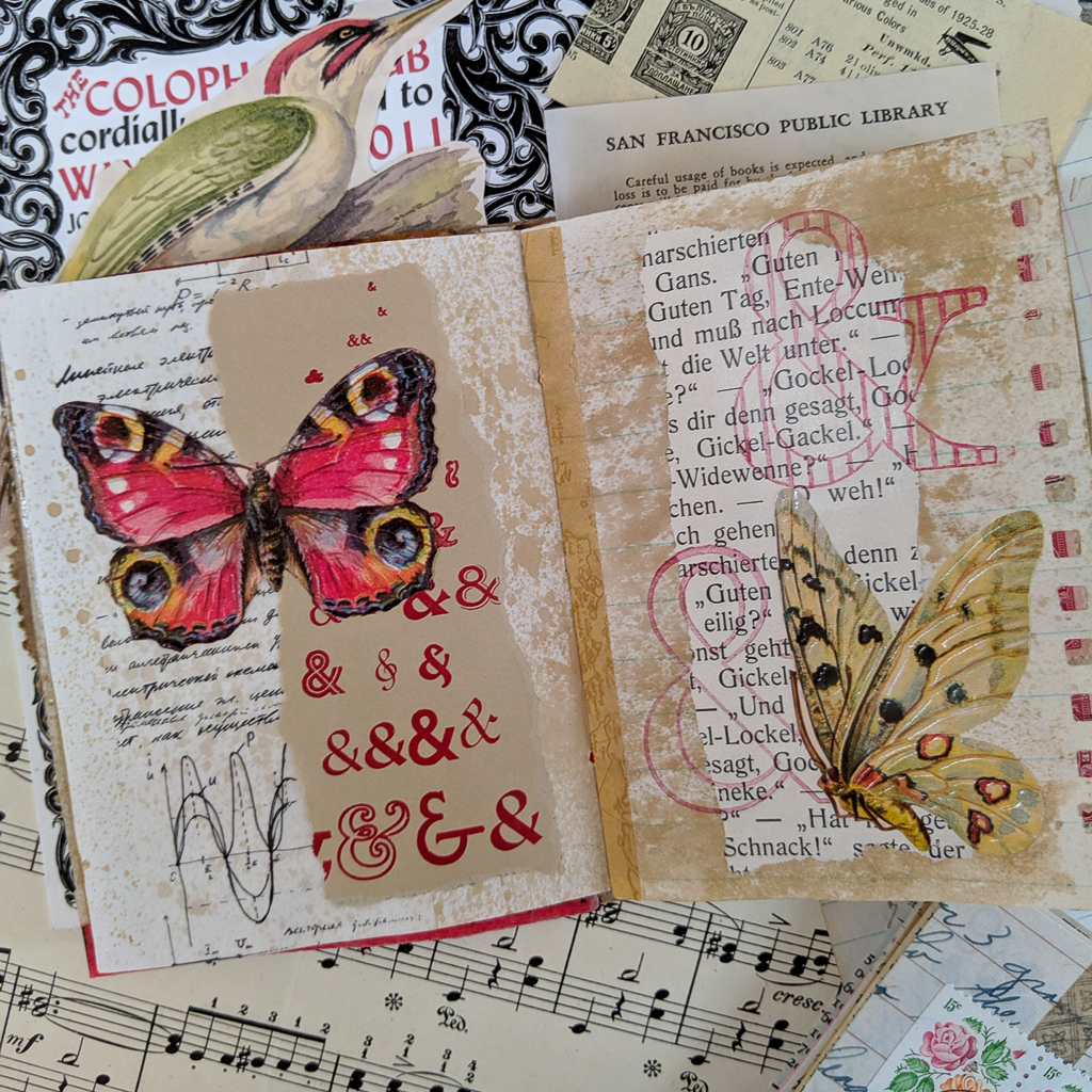 A spread of 2 pages collaged with text and butterflies