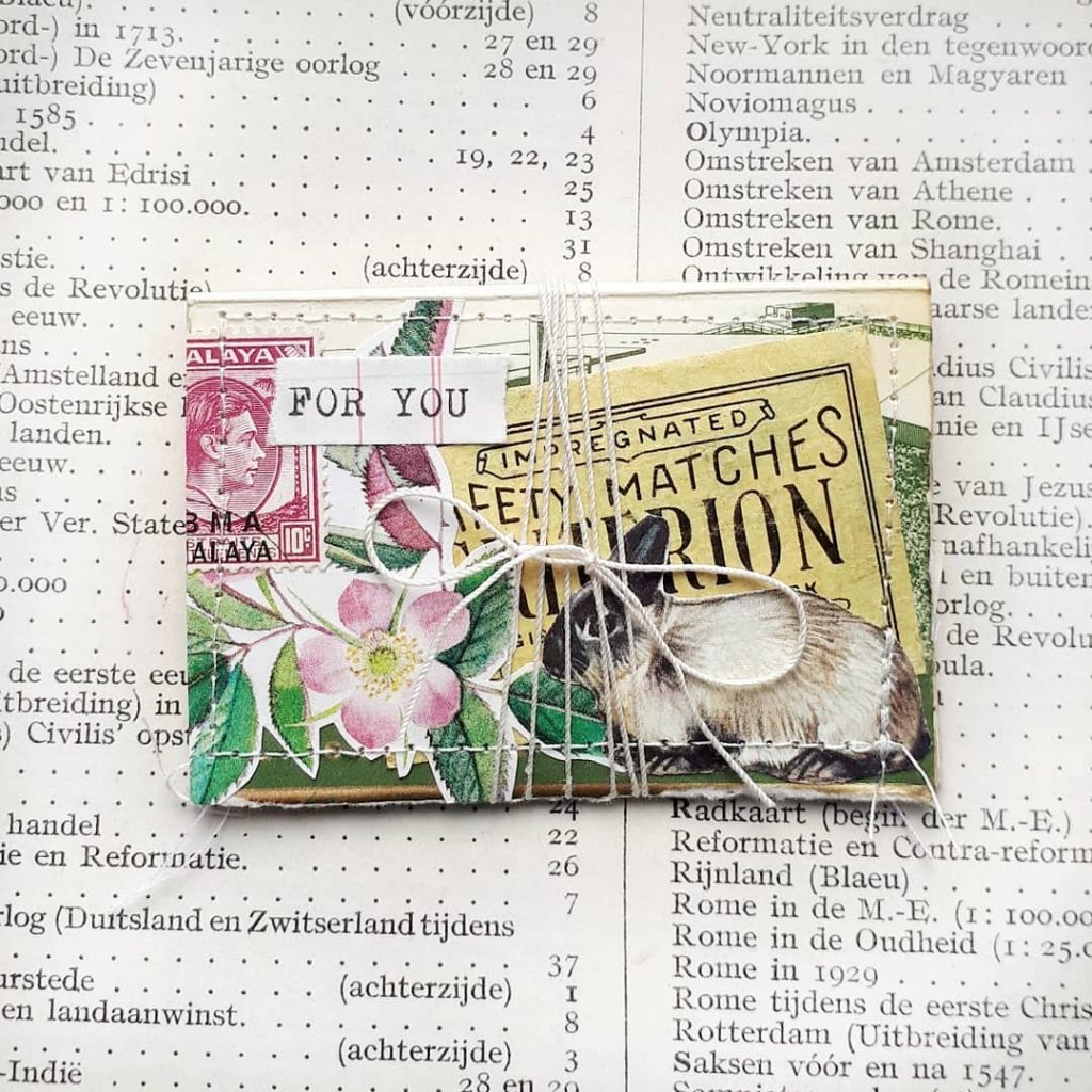 A small matchbook is decorated from the outside