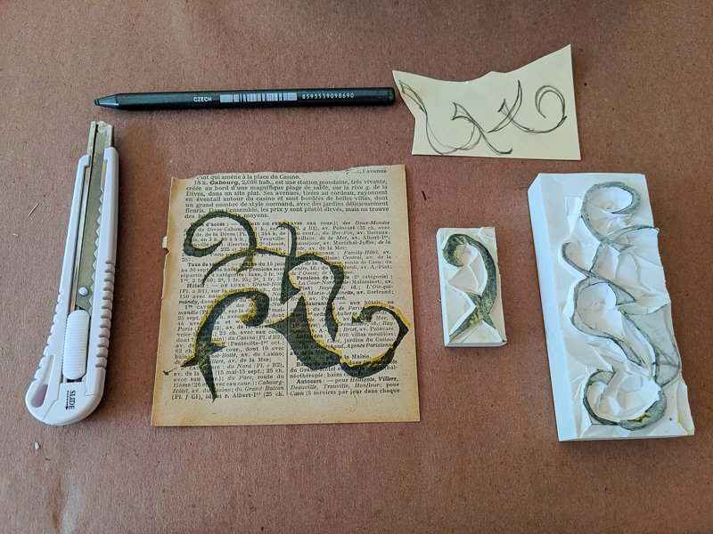 tools to carve rubber stamps and a sampling of how the stamp turned out