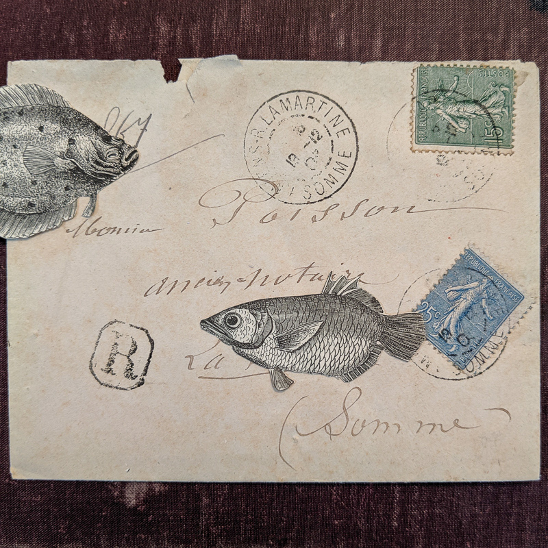 A vintage cover is decorated with fish